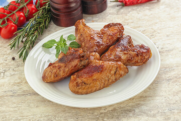 Roasted chicken wings with spicy sauce