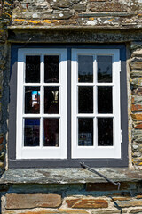 Fototapeta na wymiar Old window closeup - Beautiful scenic village of Tintagel