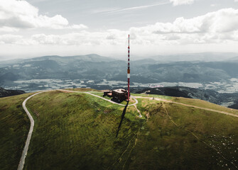 Aerial photo of broadcasting tower on the top of Kralova Hola mountain in Slovakia - Low Tatras. Beautiful and stunning scenic view of mountain with high hills around. © Matt Benzero