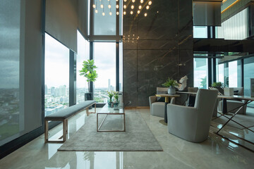 Inside of modern hotel lobby, entrance and reception, waiting area with urban city view of outdoor,...
