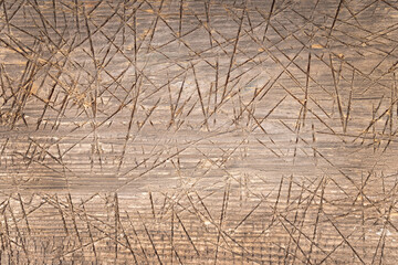 damaged wooden surface, cut and covered with scratches