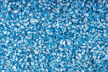 blue stones in a solid background are on the surface