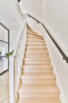corridor of duplex modern house with wooden stairs