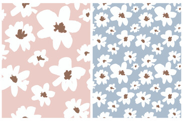 White Flowers Print. Cute Delicate Hand Drawn Floral Vector Seamless Pattern. Field of Daisies on a Baby Blue and Pastel Pink Background. Abstract Garden Repeatable Design ideal for Fabric, Textile. 
