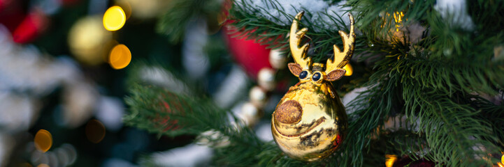 Christmas and New Year time, amazing Xmas decorations on pine trees with real snow, blurred background, banner size
