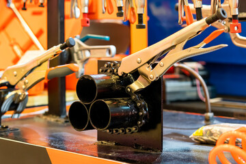 Close up locking chain pliers for fix or clamp during lock 3 metal or steel pipe in manufacturing process in industrial