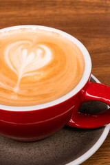 Autumn coffee and desserts close-up. Coffee break outside. Autumn drinks and mood. Flavored coffee. Bright dessert. Eclair. Coffee in male and female hands.