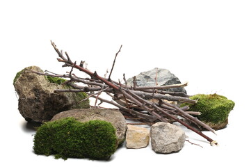Decorative dry branches and rocks with green mos, wood for campfire isolated on white  