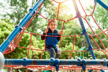 cute boy having fun on a playground