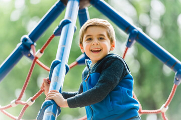 cute boy having fun on a playground