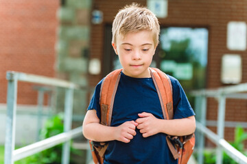Portrait of a little schoolboy with down syndrome