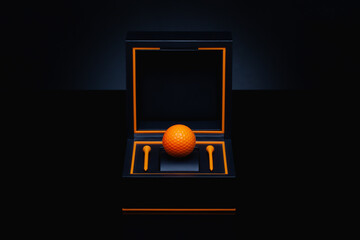Black box with orange golf ball and orange golf tees.