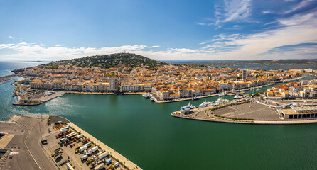 Naklejka premium Aerial view of the old town center of Sete in the South of France - Two urbanised islands surrounded with ancient canals between the Mediterranean Sea and the Pond of Thau.