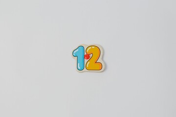 Closeup of a number 12 isolated on a white background