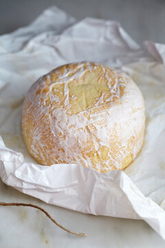 Close-up of brie cheese on paper
