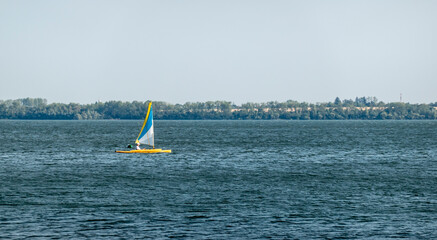 A sailboat sailing on a large lake
