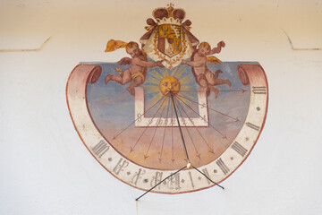 Fototapeta na wymiar Old sundial on a wall in Vaduz in Liechtenstein