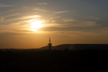 Tv broadcasting tower on sunset background, Cracow