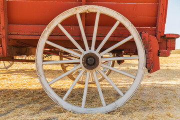 Wheels on a farm wagon used to harvest wheat.