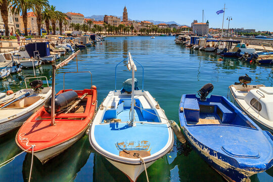 Coastal summer cityscape - view of the boat dock and the Split promenade, the Adriatic coast of Croatia