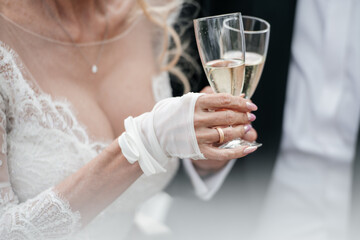 bride and groom holding champagne glasses