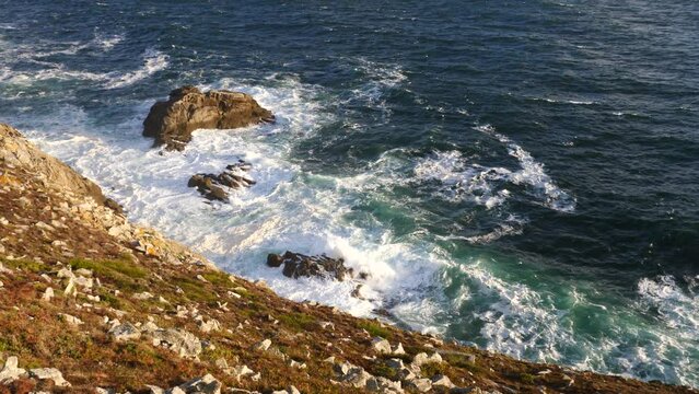 A close-up of a rough sea during sunset. Pointe du Raz, France, the 5th September 2022.