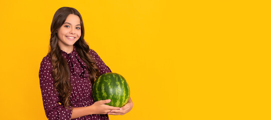 Fototapeta premium watermelon on yellow background. kid with fruit. healthy food for children. Summer girl portrait with watermelon, horizontal poster. Banner header with copy space.