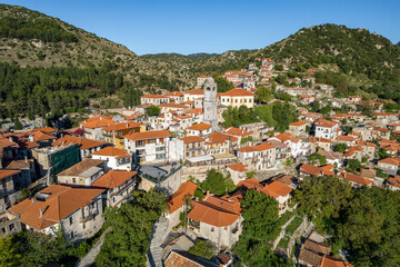 Naklejka na ściany i meble Aerial view of the historical village Dimitsana with the traditional houses and the famous clock tower in Arcadia, Peloponnese, Greece