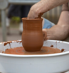 hands of a potter at work
