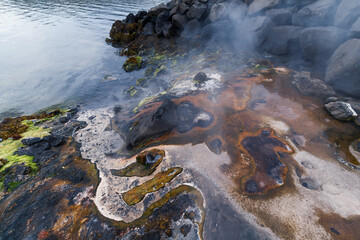 Natural hot geothermal water leaks to the sea - Iceland western fjords