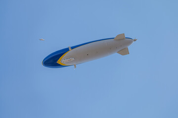 Fototapeta na wymiar Zeppelin flying over the sky - In summer sky - Denmark