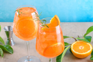 Classic italian aperitif aperol spritz cocktail in two wineglasses with ice cubes and slice of...
