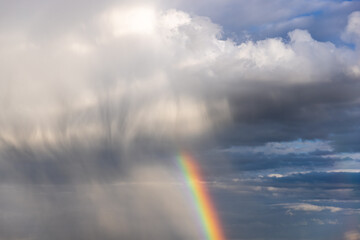 Rainbow colorful sunset on blue pink sky yellow clouds skyline. blue sky with white clouds - perfect for sky replacement	