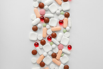 Many different pills on white background. Copy space. Top view. Concept of pharmaceuticals, medicine