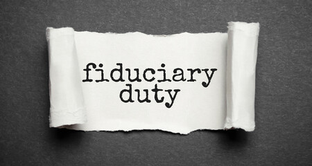 Paper with text fiduciary duty on wood table