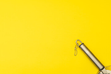 Pizza cutter on yellow background