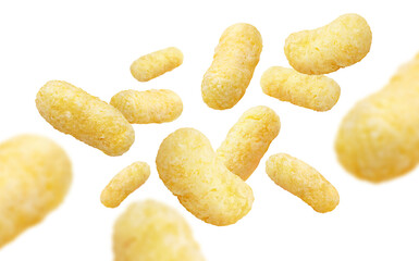 Delicious corn sticks flying on white background