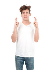 Naklejka premium Hopeful young guy with a crossed fingers expression