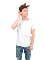 Concerned young guy trying to listen with his hand