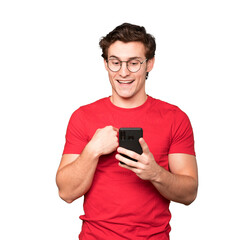 Surprised young man using his mobile phone