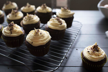Close-up of cupcakes arranged on metal grate