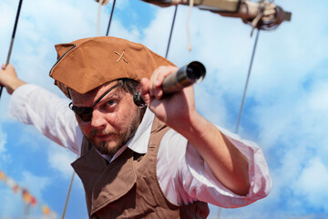 Naklejka premium the pirate captain traveler discoverer and explorer on the vintage pirate ship 
