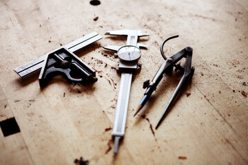 High angle view of work tools on messy wooden table