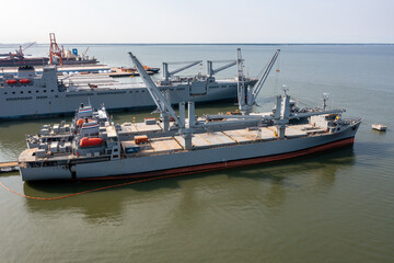 Fototapeta premium Aerial View of Merchant Marine Ships Docked Near Downtown Newport News Virginia