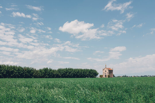 Cappella Nicolaus Braida against sky with grassy field in foreground