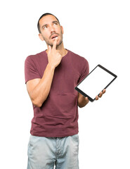 Young man doing gestures using a tablet