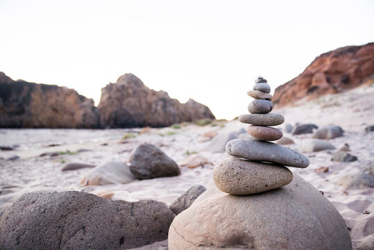 Stack Of Pebbles At Beach Against Clear Sky