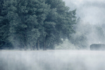Scenic view of lake during foggy weather