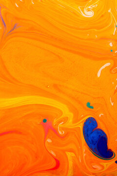Close-up of orange and blue marbling painting