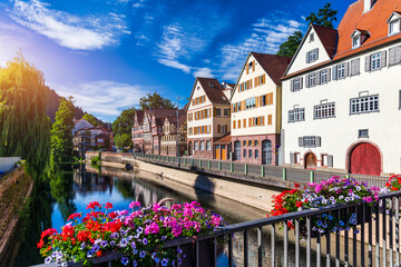 Beautiful floral colorful town Tubingen in Germany (Baden-Wurttemberg). Houses at river Neckar and Hoelderlin tower, Tuebingen, Baden-Wuerttemberg, Germany. Tubingen, Germany. - obrazy, fototapety, plakaty